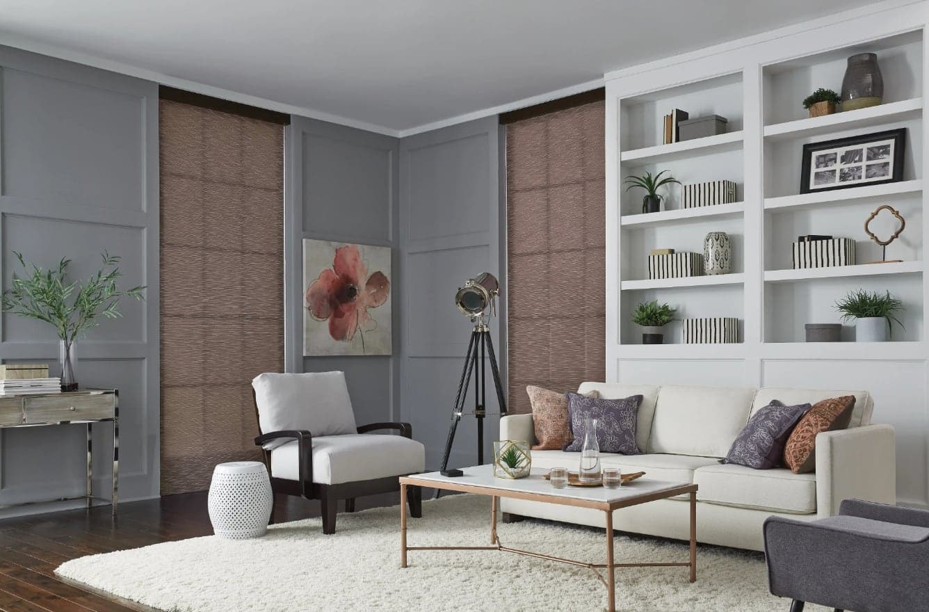Elegant living room styled with Lutron sliding panel track shades